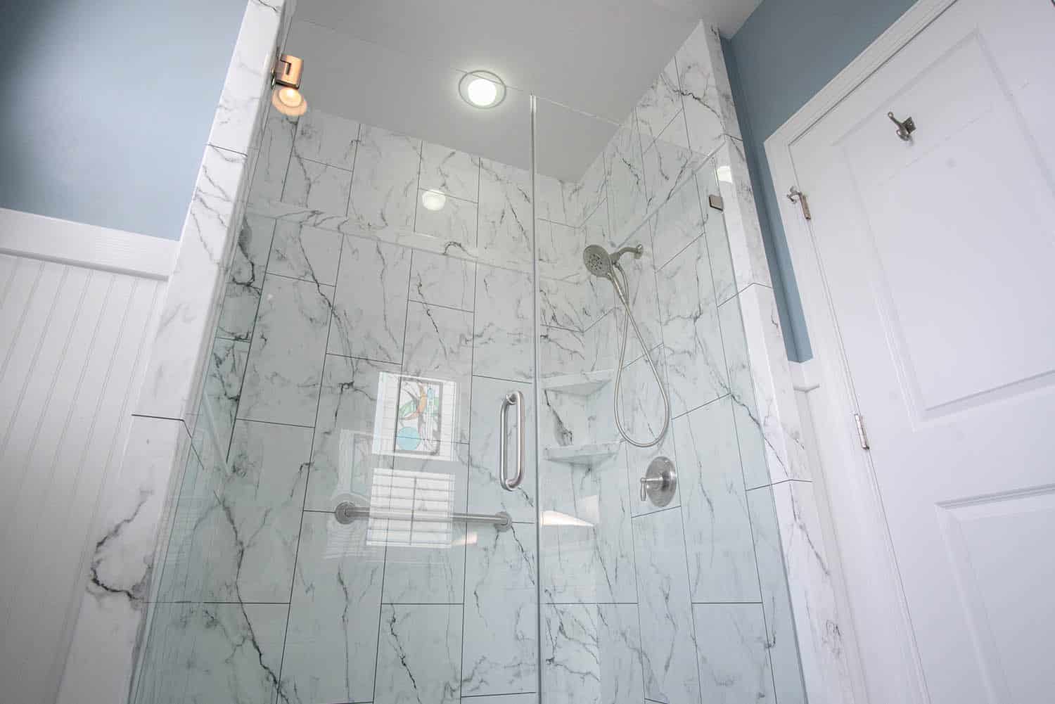 Featured Image of a After photo of walk-in shower replacement with marble-look walls in Holly Ridge NC bathroom remodel